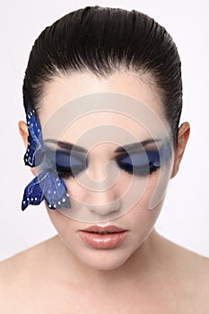 Clean Image of A woman With Butterfly Make Up