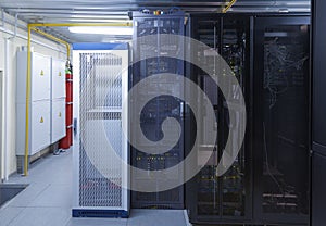 Clean industrial interior rack server hardware room in data center