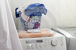 Clean laundry basket over the washing machine.