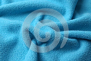 Clean light blue microfiber cloth as background, closeup