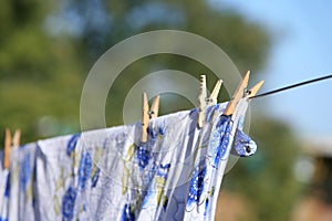 Clean linen hungs on rope dries photo