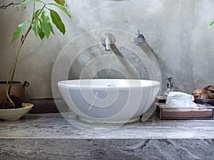 Clean loft style bathroom interior with modern sink basin faucet