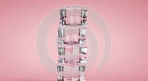 Stack of Transparent Ice Cubes on Pink Background