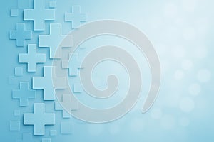 Abstract medical background with light blue plus symbols and bokeh effect