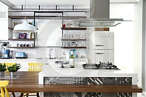 Clean modern kitchen with stylized designs on the cooking counter