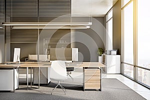 Clean office interior with equipment, furniture, sunlight, window with city view and concrete flooring. Worplace and workspace