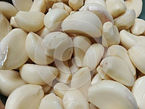 Clean peeled garlic is ready to be consumed photo