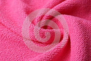Clean pink microfiber cloth as background, closeup