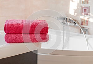 Clean pink towels in bathroom