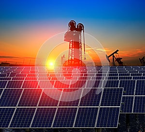 Clean power energy concept,Oil pump with solar panels and the sunset