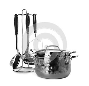 Clean saucepans and utensils isolated on white