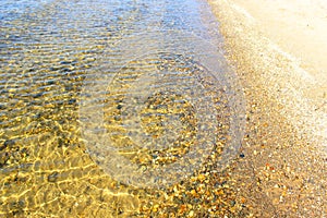 Clean sea water and stones at the bottom. Rocky seashore. Pebbles and rocks underwater underwater.Close-up and top view