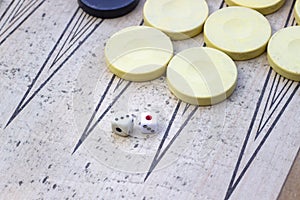 Clean shoot of dices of backgammon under clean light with play stones