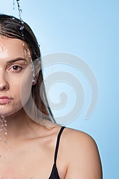 Clean skin, drops and trickles of water on the face. photo