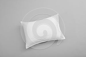 Clean soft bed pillow on grey background