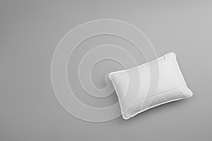 Clean soft bed pillow on grey background