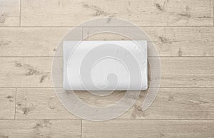 Clean soft bed pillow on wooden background