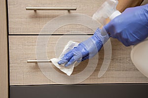 Clean surfaces using soap and water. Practice routine cleaning of frequently touched surfaces. photo