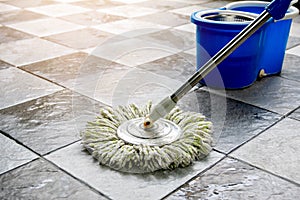 Clean tile floors with mops and floor cleaning products