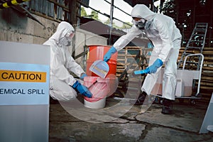 Clean up Chemical Liquid Spill. Scoop Materials into Toxic Waste Red Bag and Thick Plastic Barrels for Disposal, Dispose of