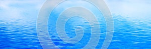 Clean water background, calm waves. Banner, panorama
