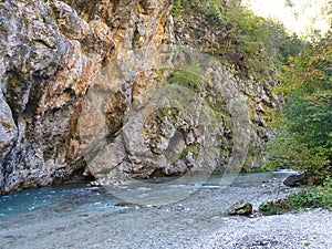 Clean water of Savinja river - between rocks in autumn Slovenia