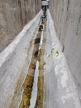 clean and well-maintained water ditches with clean water photo