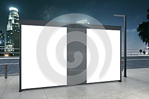 Clean white bus stop billboard on night city backdrop. Commercial and ad concept. Mock up, 3D Rendering