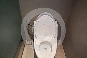 Clean white ceramic toilet bowl in luxury hotel