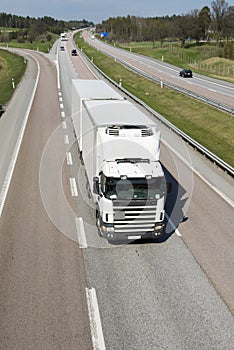 Clean, white lorry on highway