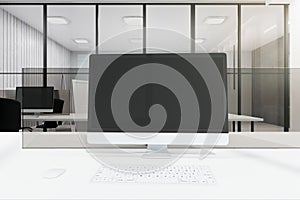 Clean white office with computer