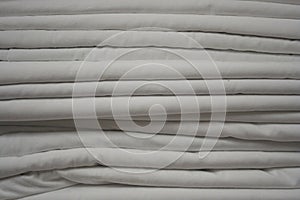 Seamless texture of a stack of folded white sheets