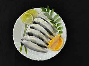 Cleaned and ready to cook fresh indian oil sardine photo