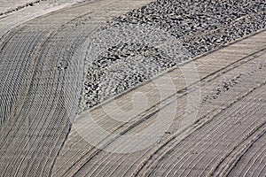 Cleaned by a tractor and people trampled sand on the Mediterrane