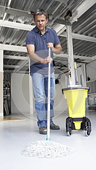 Cleaner mopping office floor