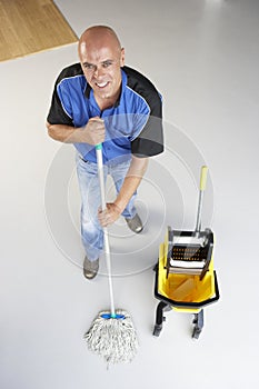 Cleaner mopping office floor