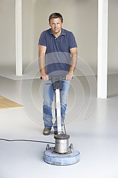 Cleaner polishing office floor photo