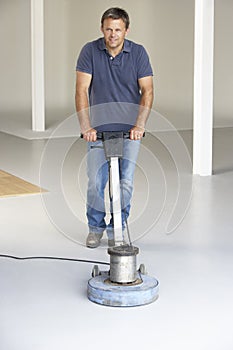 Cleaner polishing office floor photo