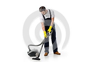 cleaner in uniform and rubber gloves with vacuum cleaner