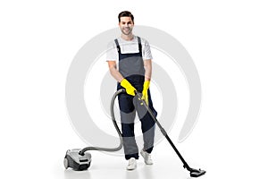 cleaner in uniform and rubber gloves with vacuum cleaner