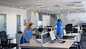 Cleaners clean empty office spaces photo