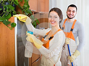 Cleaners cleaning in room