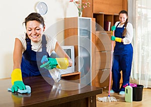 Cleaners cleaning in room