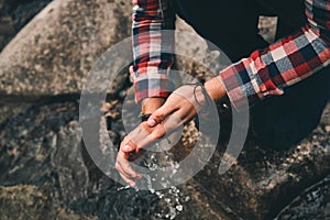 Cleanest water. Close up top view of young man washing hands in