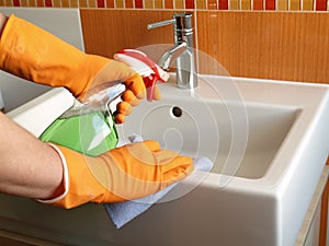 Cleaning bathroom sink photo