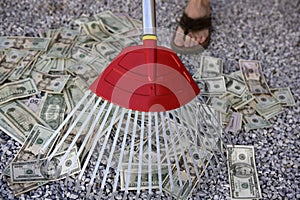 Cleaning black dolar money with rake, metaphor