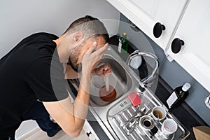 Cleaning Blocked Drain Clog In Kitchen Sink