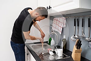 Cleaning Blocked Drain Clog In Kitchen Sink photo