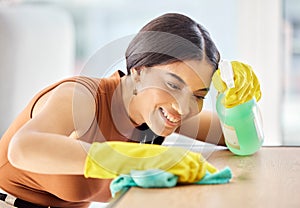 Cleaning, bottle and black woman spray table, desk or furniture bacteria with liquid chemical disinfectant. Housekeeping