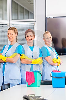 Cleaning brigade working in office